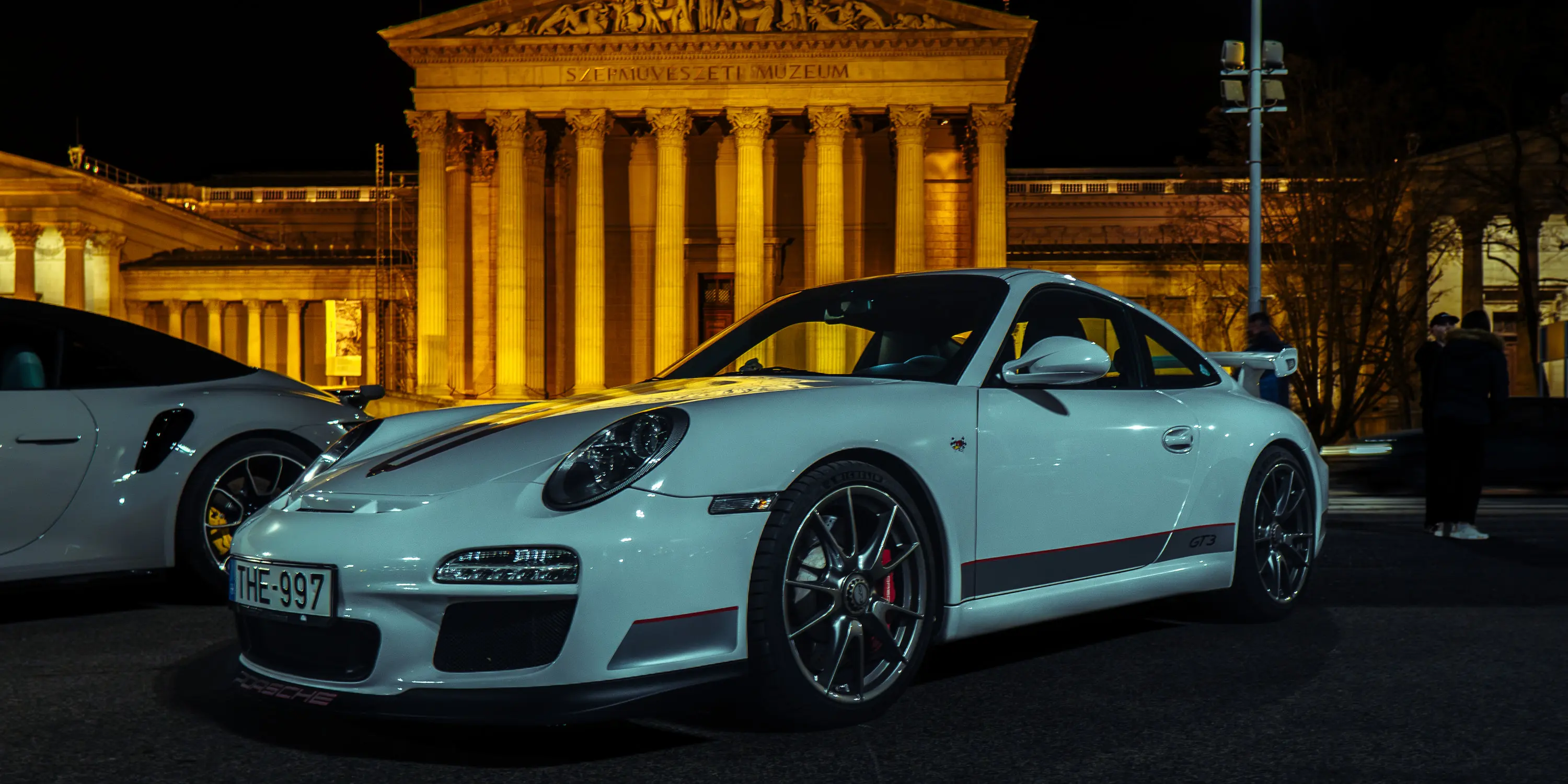 Porsche, floodlit stone